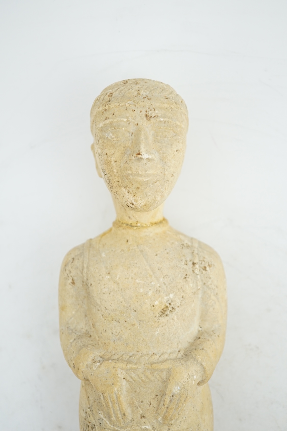 An unusual limestone votive figure, with cuneiform inscription, possibly Mesopotamian